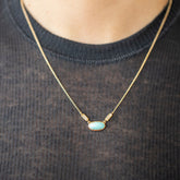 product_details::Thar Necklace on model.