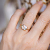 product_details::Cushion Diamond Gusher Ring on model.