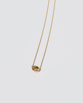 Motivation Necklace on light color background.