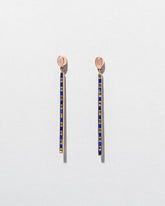 Peach Moonstone Transformation Earrings on light color background.