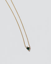 Rise Necklace on light color background.