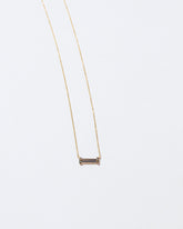 Honokalani Necklace on light color background.