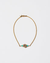 Sunstone & Turquoise Eye Bracelet on light color background.