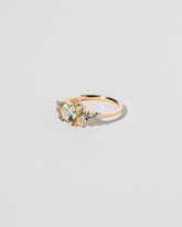 Hexagonal Slice Sapphire Cluster Ring on light color background.