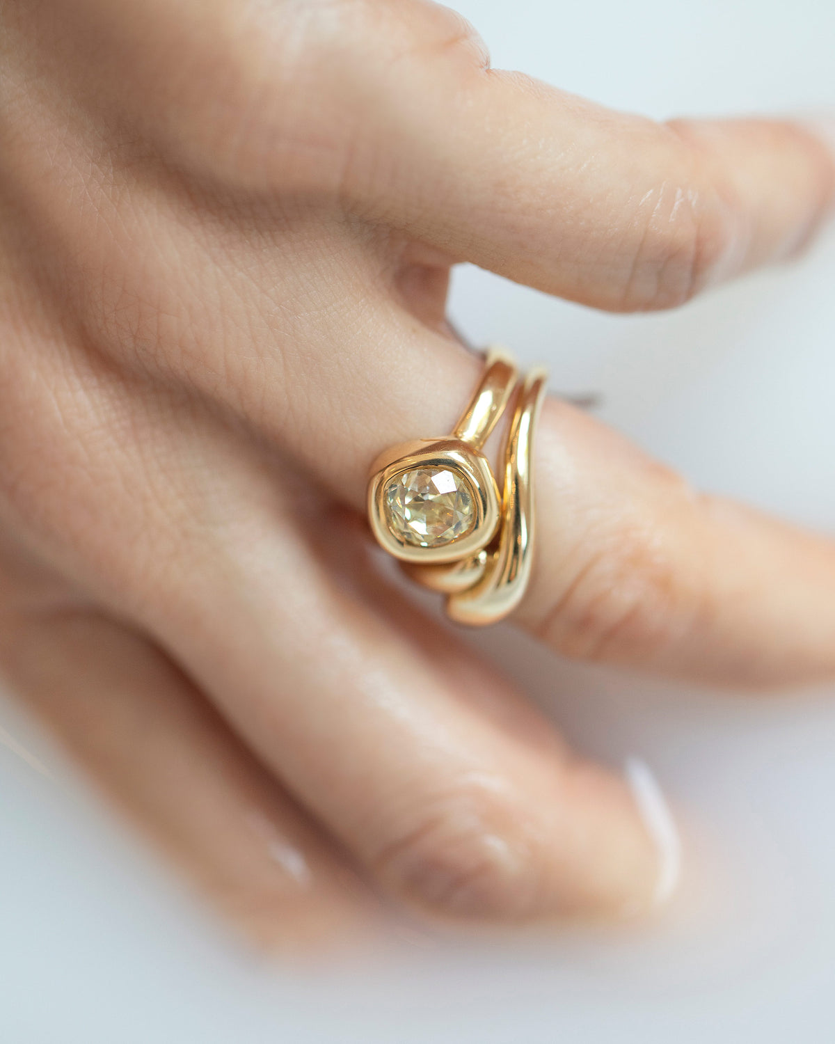 Gold Align Band and Yellow Diamond Balanced Ring on model.