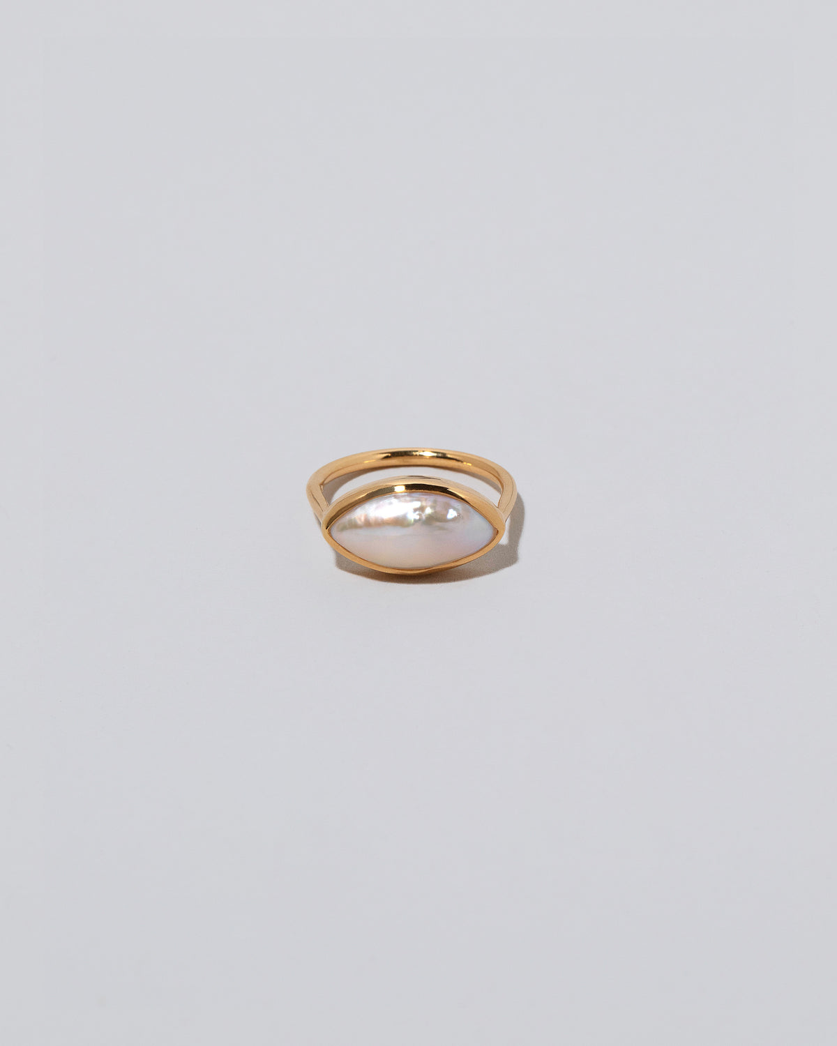 18k Gold Jacana Pearl Ring on light color background.