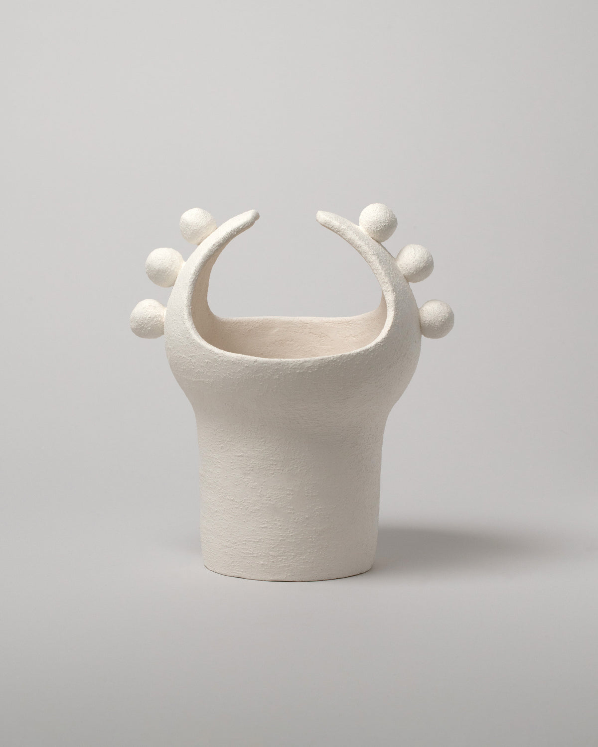 Stephanie Phillips White Moon Bulb Sculpture on light color background.