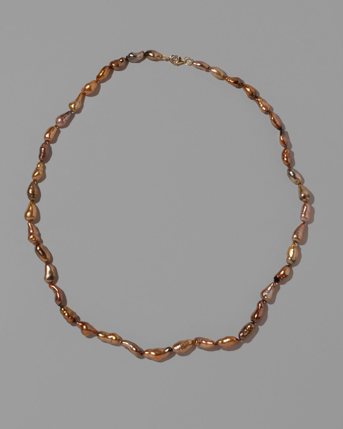 Scylla Necklace on light color background.