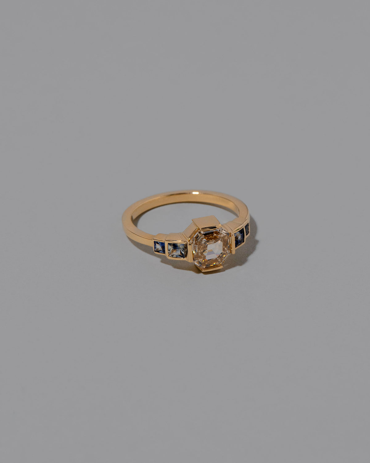 View from the side of the Treasure Ring on light color background.