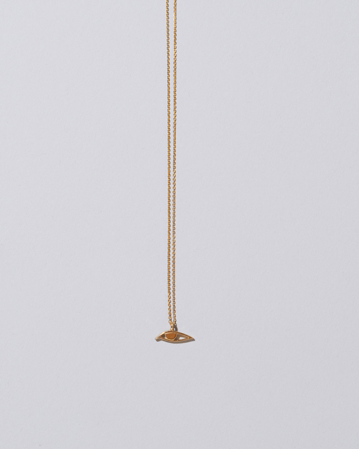 Eye Talisman Pendant Necklace on light color background.