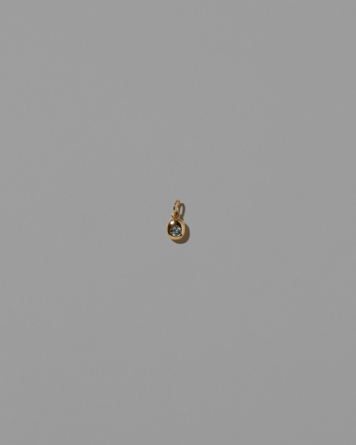 Aquamarine Birthstone Level Charm on light color background.