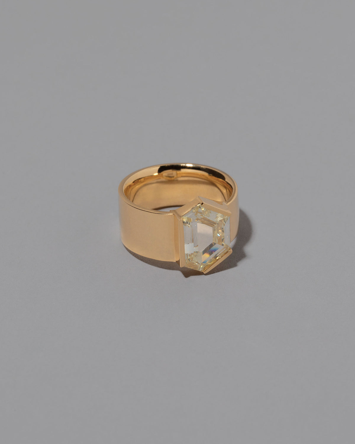 View from the side of the Wrap Ring on grey color background.