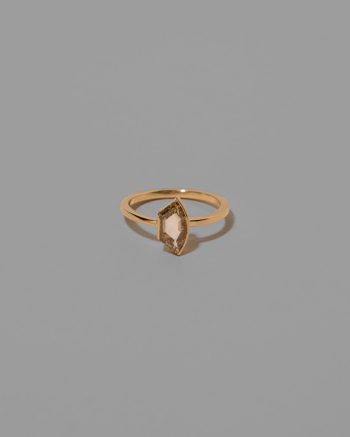 Adulation Ring on light color background.