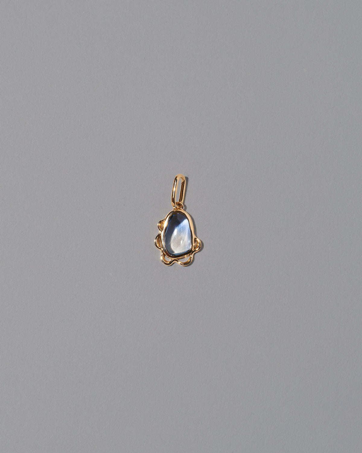 Karmic Balance Pendant on light color background.