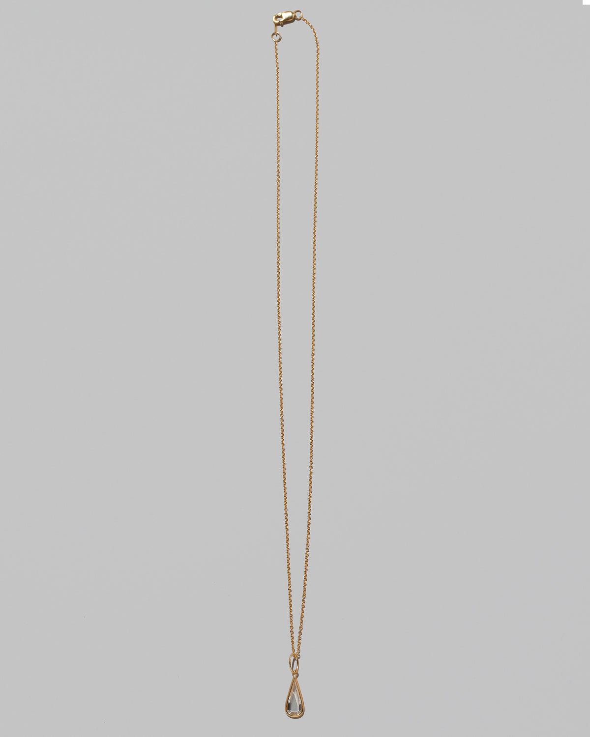 State Shifter Diamond Pendant paired with chain on light color background.