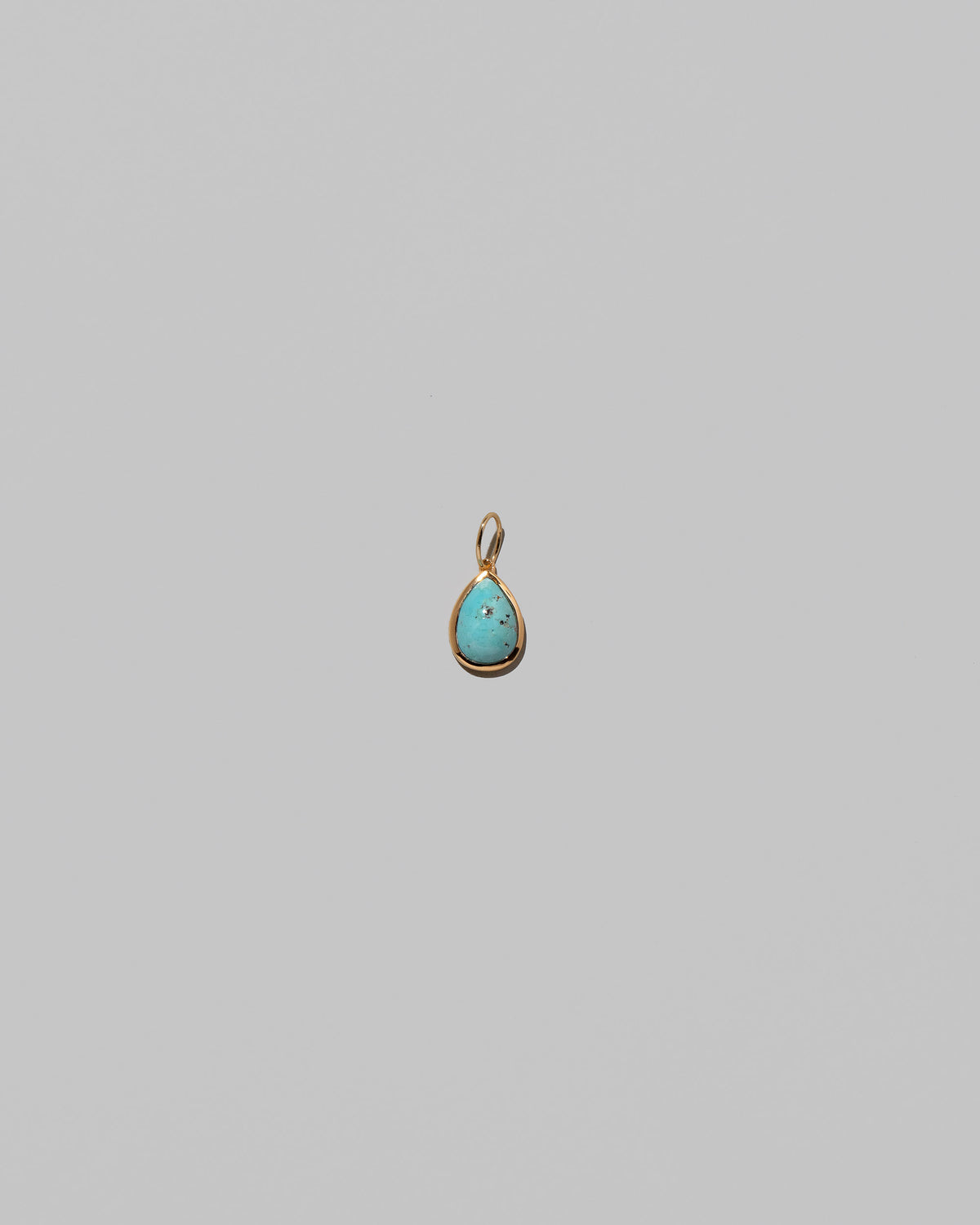 State Shifter Turquoise Pendant on light color background.