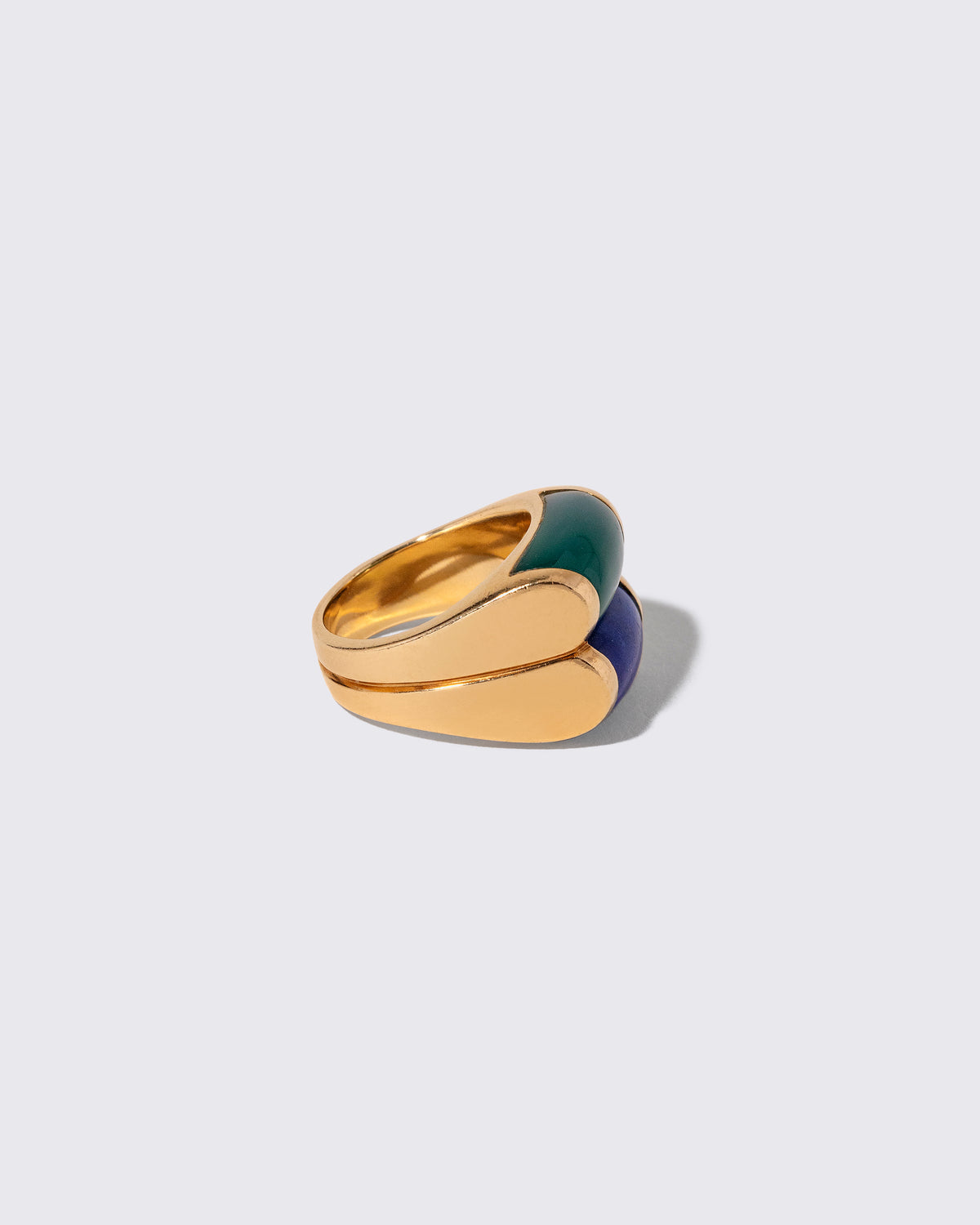 Detail view of the Vintage Bvlgari Doppio Tronchetto Lapis & Chalcedony Ring on light color background.