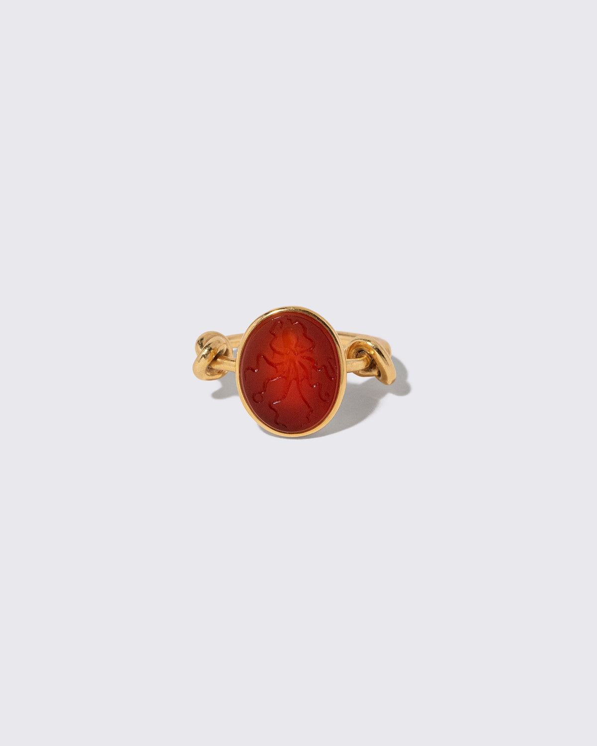 Vintage JAR Carnelian Ring on light color background.
