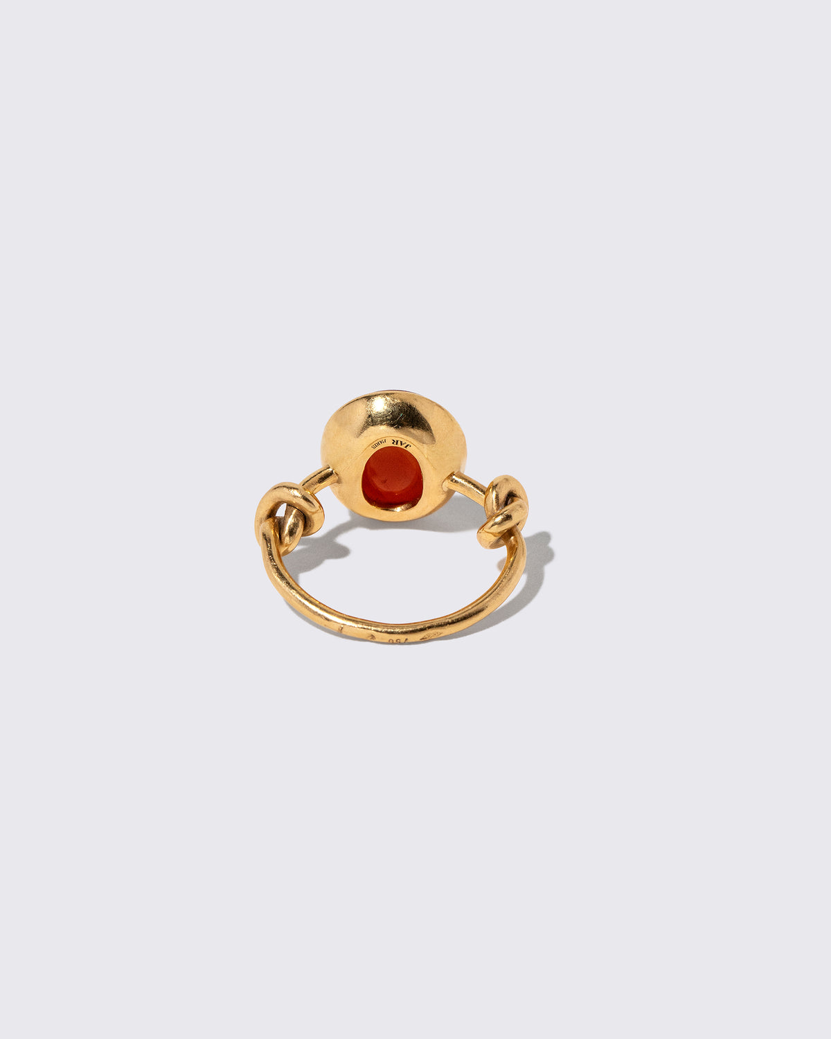 View from the back of the Vintage JAR Carnelian Ring With Box on light color background.