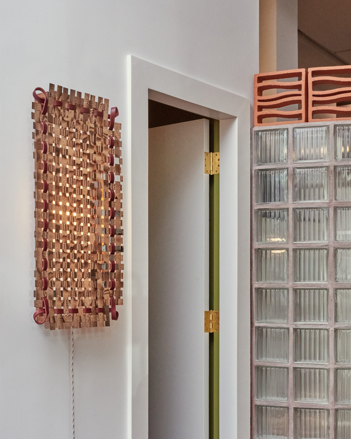 Styled image white lit of the Bower Studios Woven Mirror II.