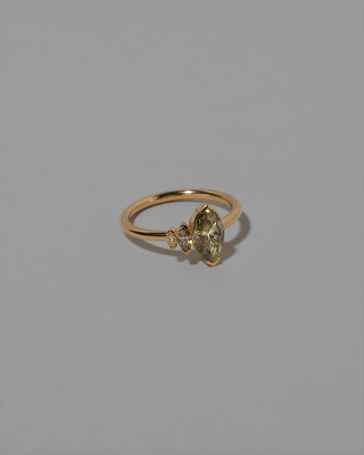 View from the side of the Romance Ring on light color background.