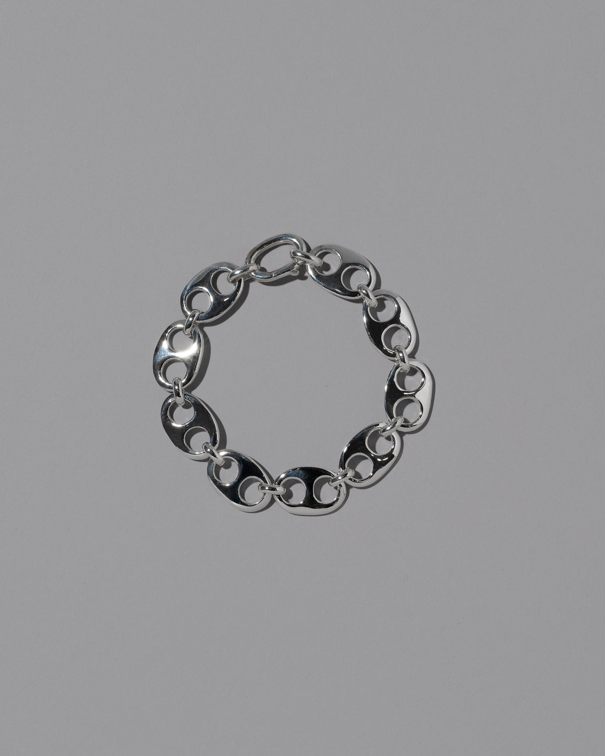 CRZM Sterling Silver Yuba Medium Bracelet on light color background.