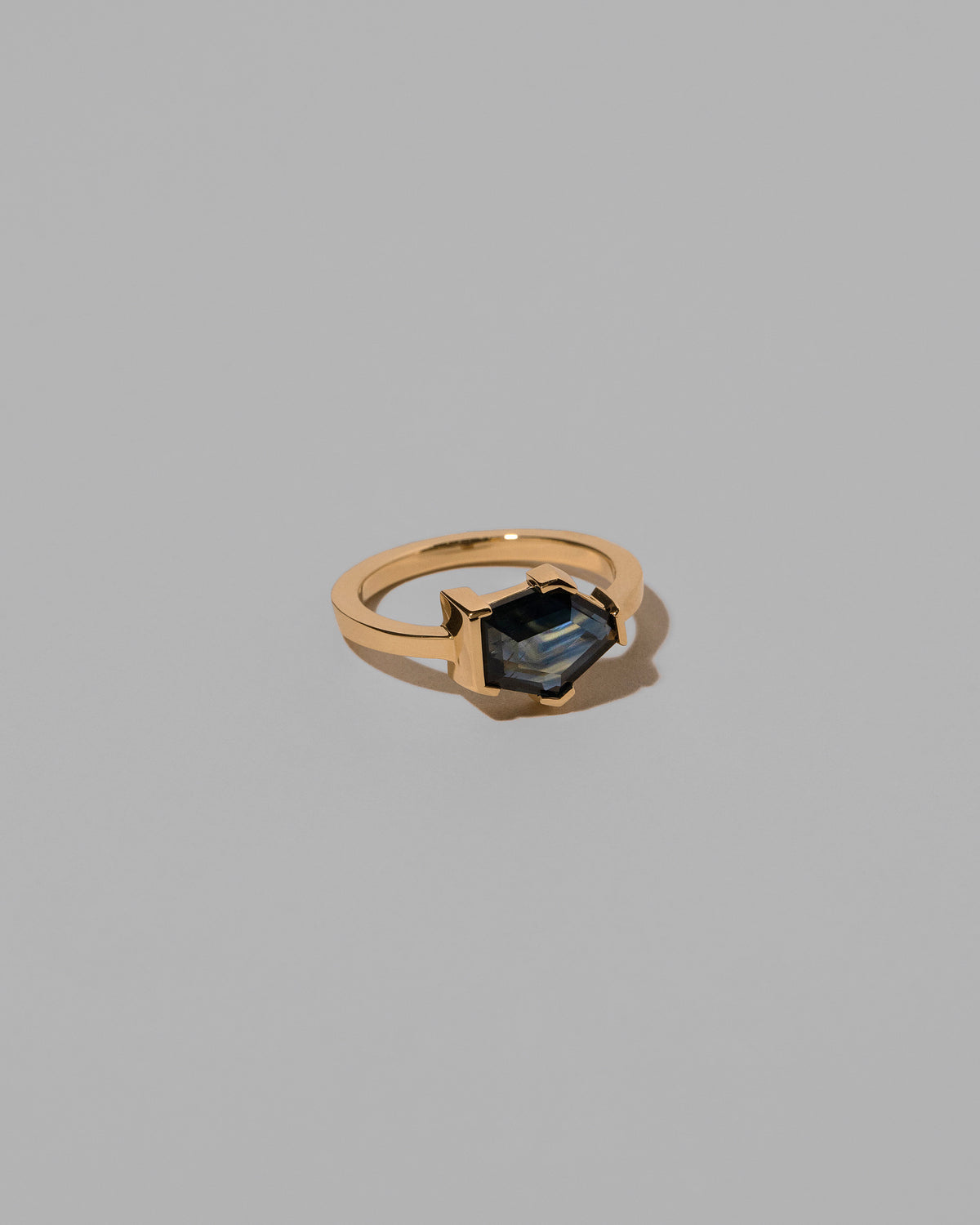 View from the side of the Caring Ring on light color background.