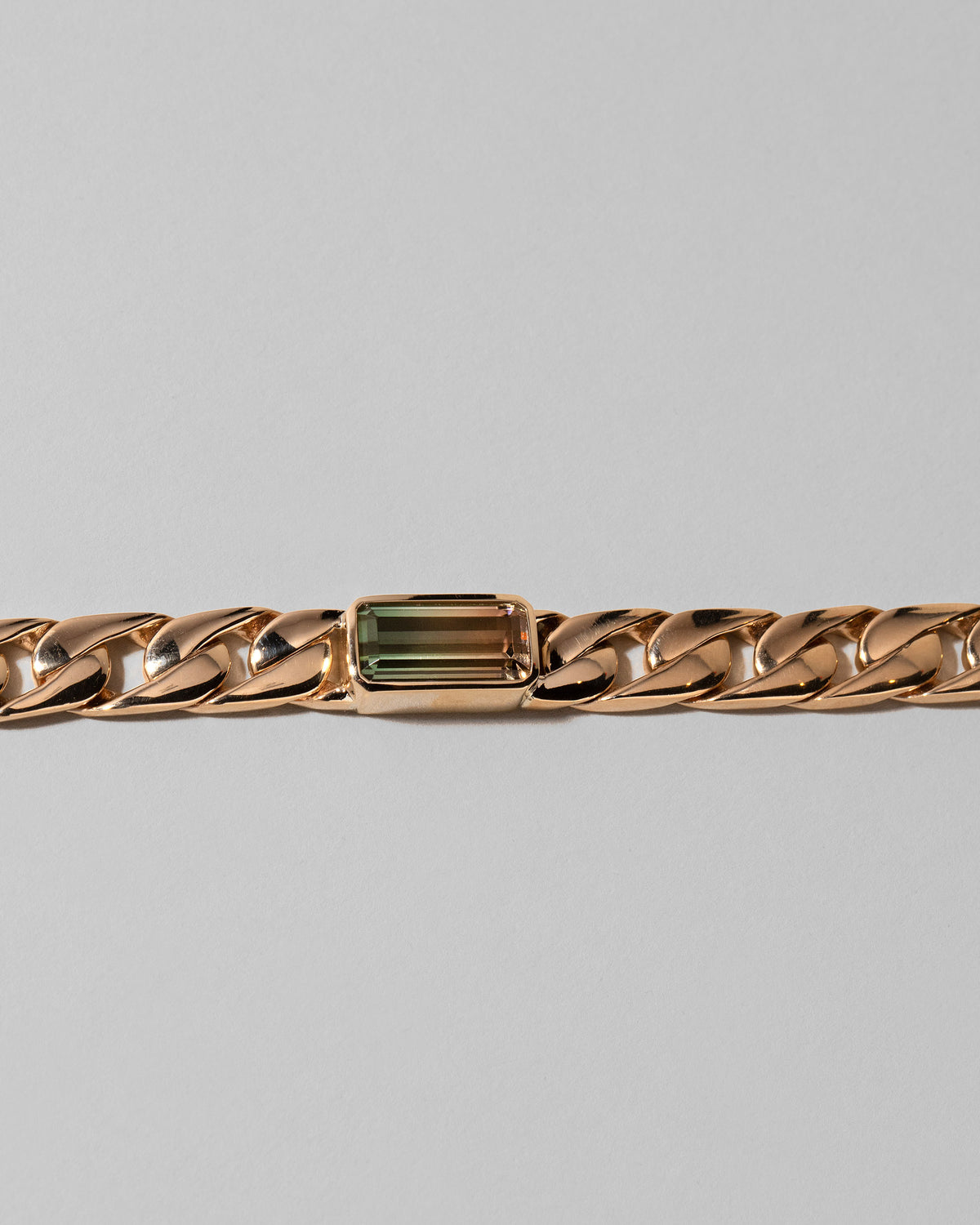 Closeup details of the Identity Chain Bicolor Tourmaline Bracelet 003 on light color background.