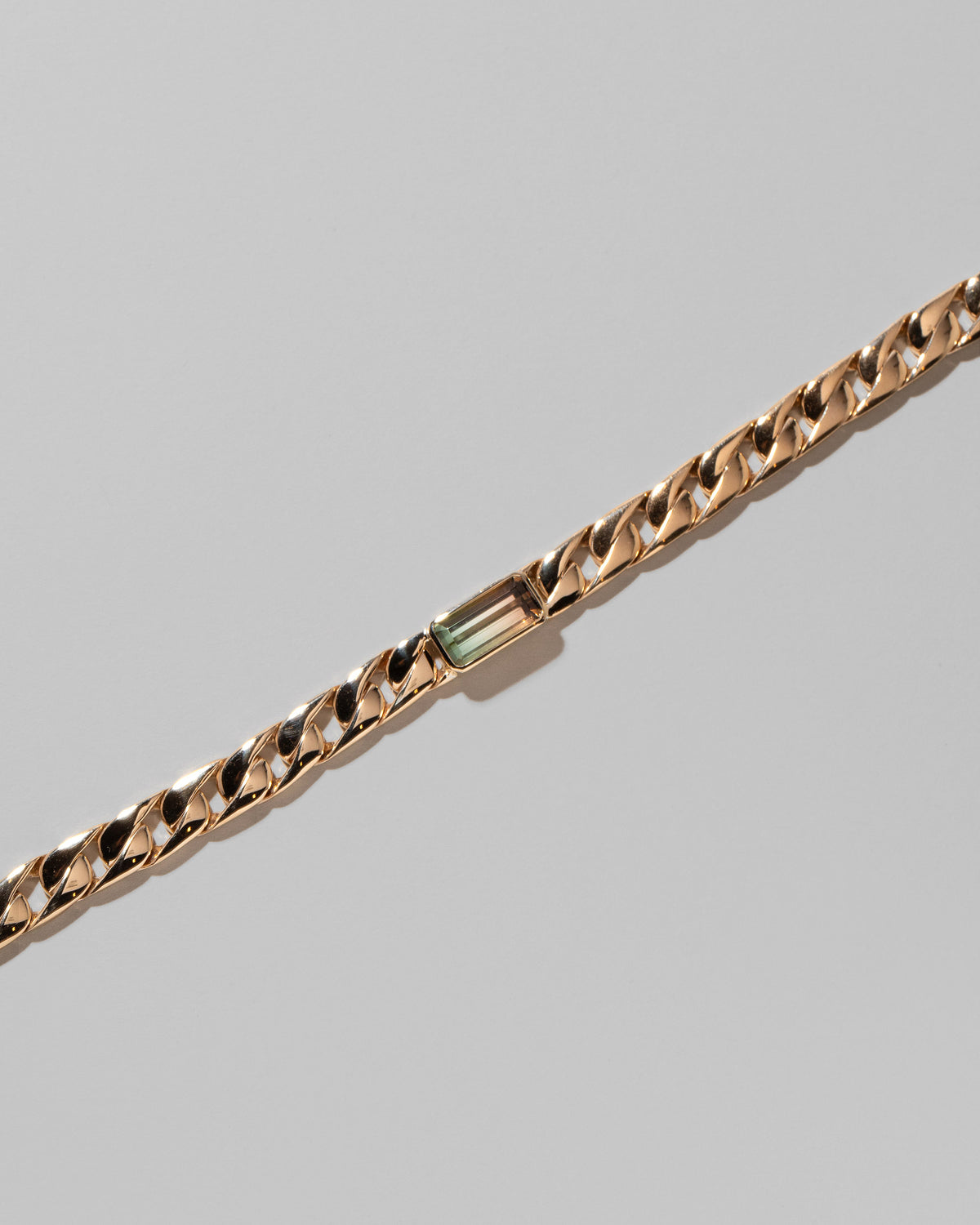 Closeup details of the Identity Chain Bicolor Tourmaline Bracelet 003 on light color background.
