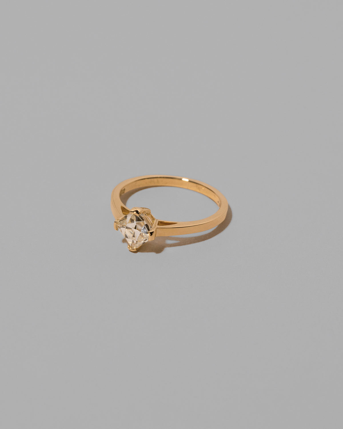 View from the side of the Delight Ring on light color background.