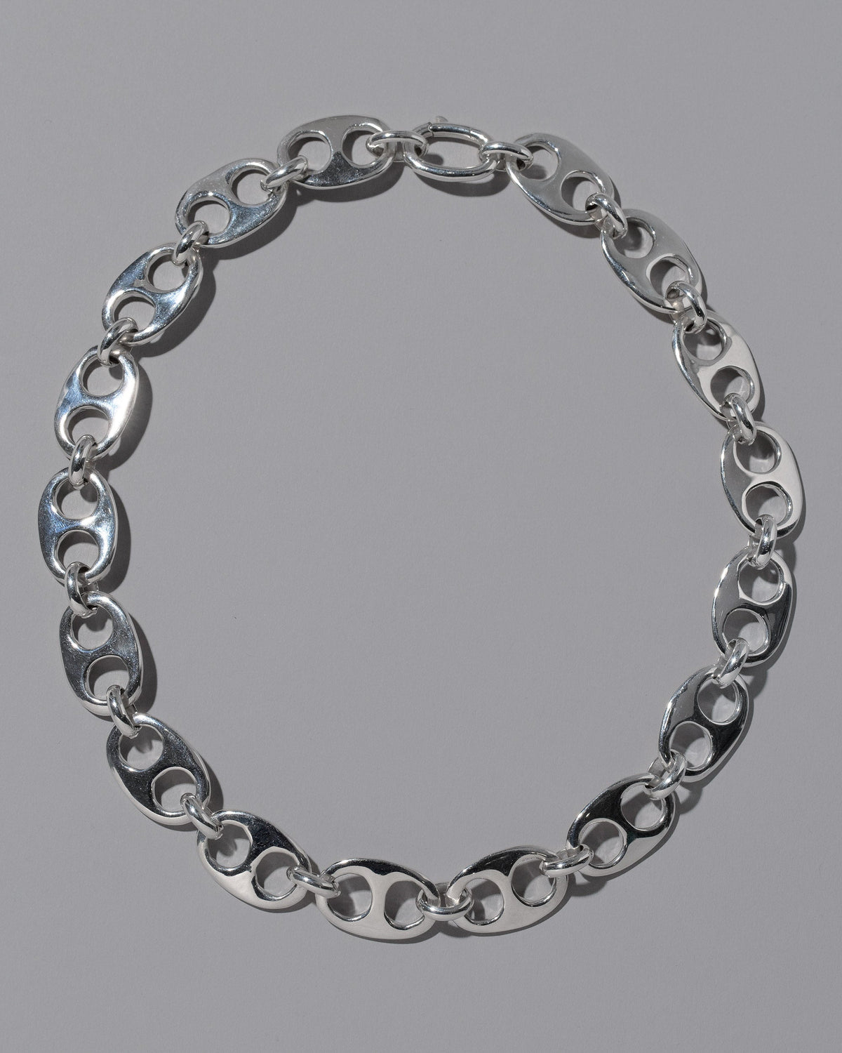 CRZM Sterling Silver Yuba Necklace on light color background.