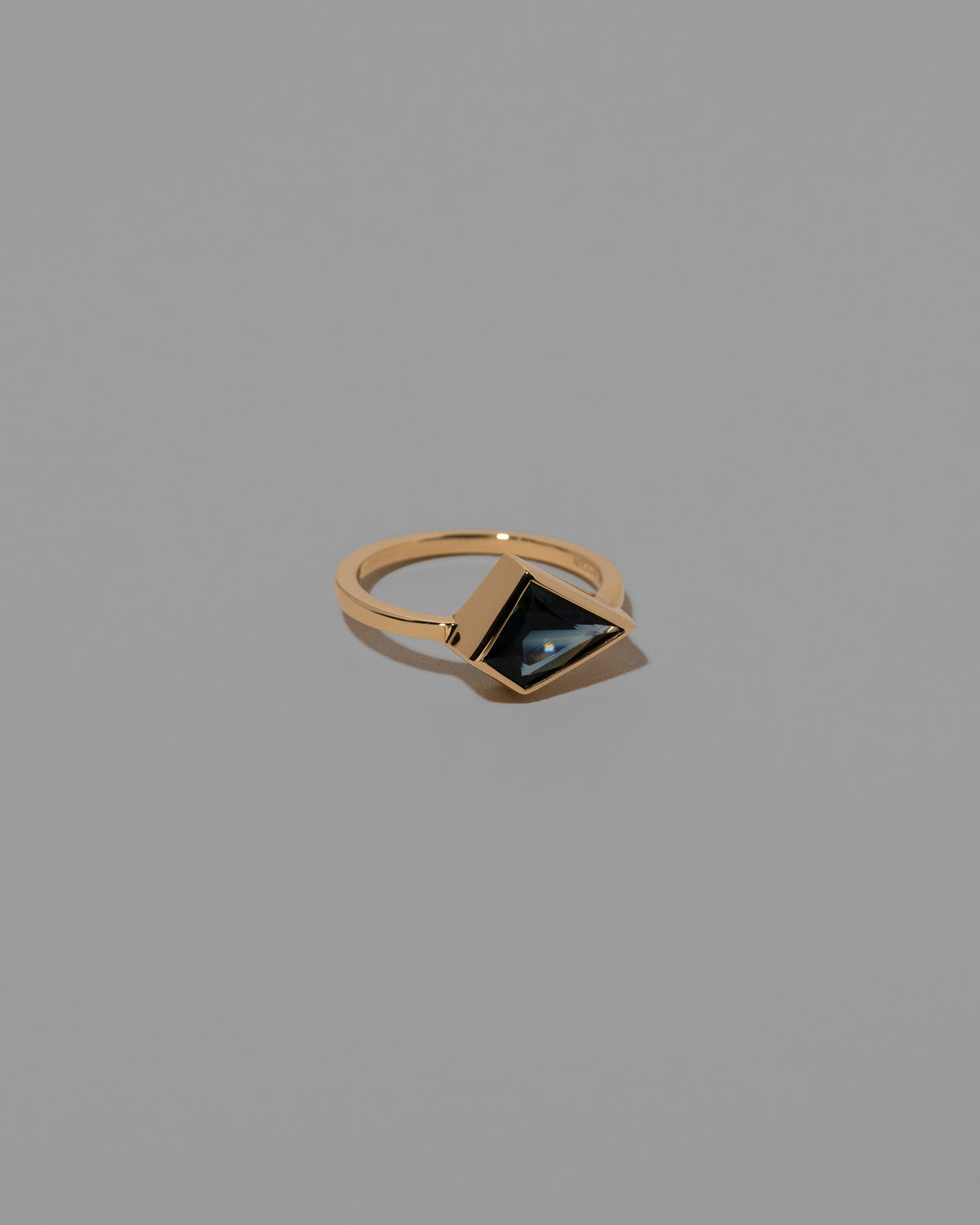 View from the side of the Lovesick Ring on light color background.