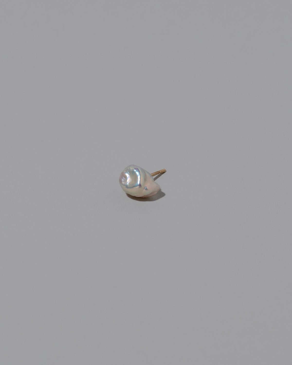 Natural Lagniappe Pearl Stud Earring Single on light color background.
