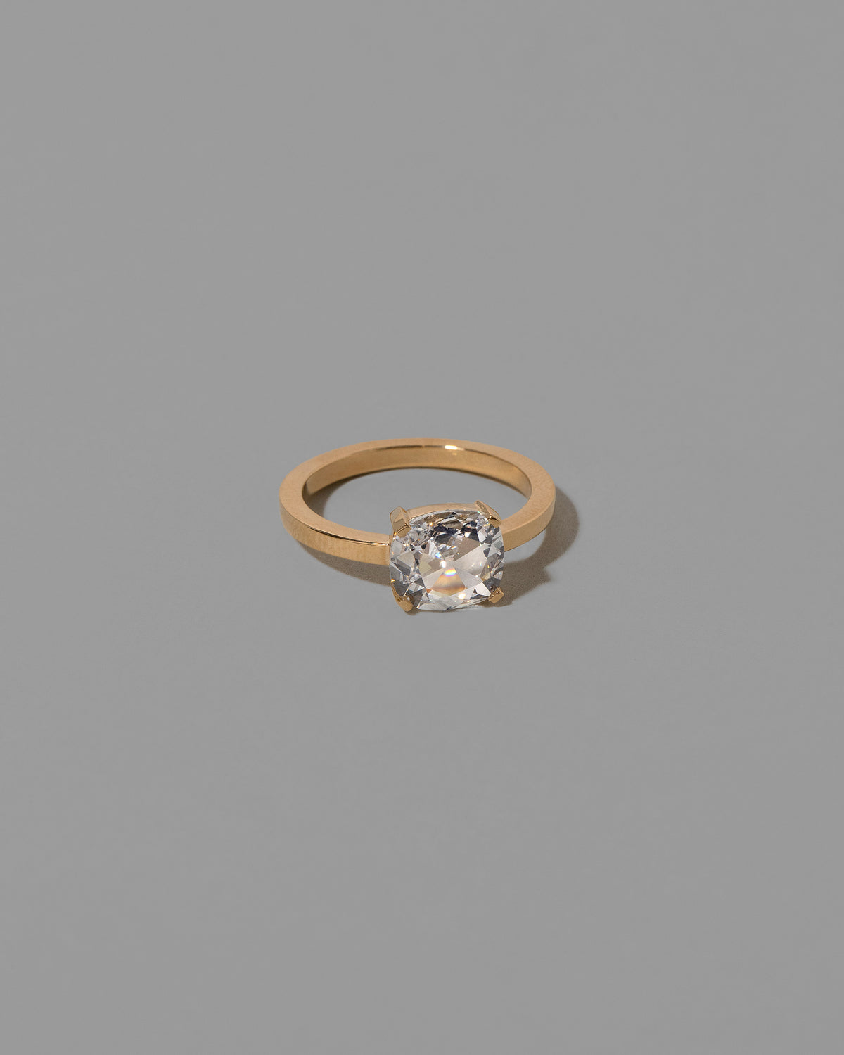 View from the side of the Transfiguration Ring on light color background.