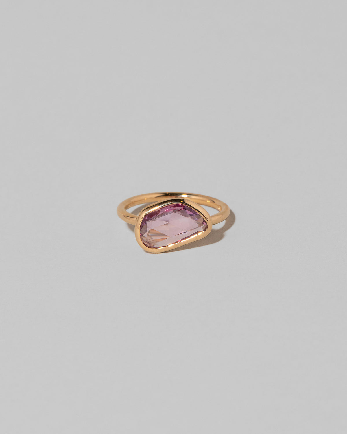 Gusher Pink Sapphire Ring 011 on light color background.