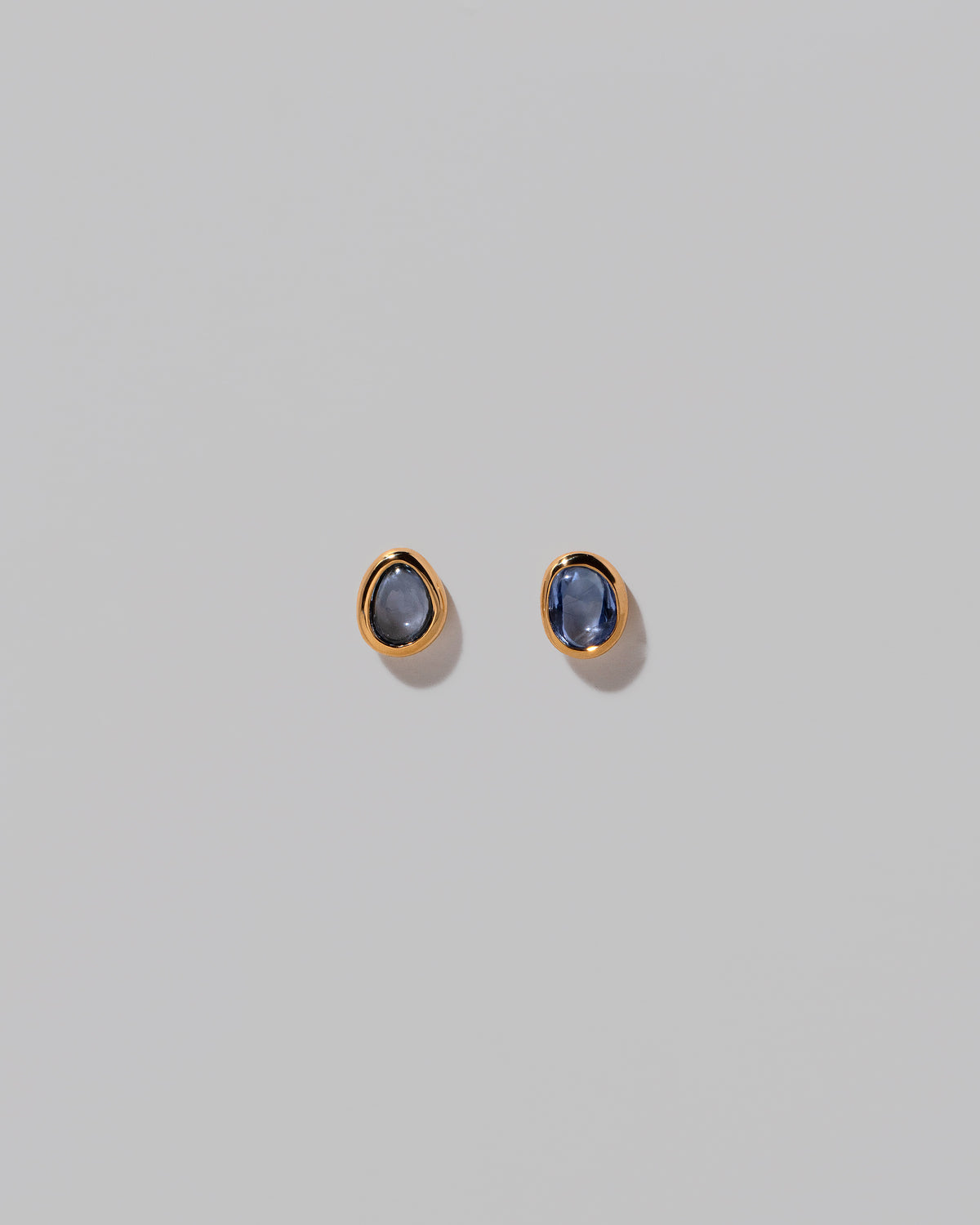 Gusher Blue Sapphire Stud Earrings 002 on light color background.