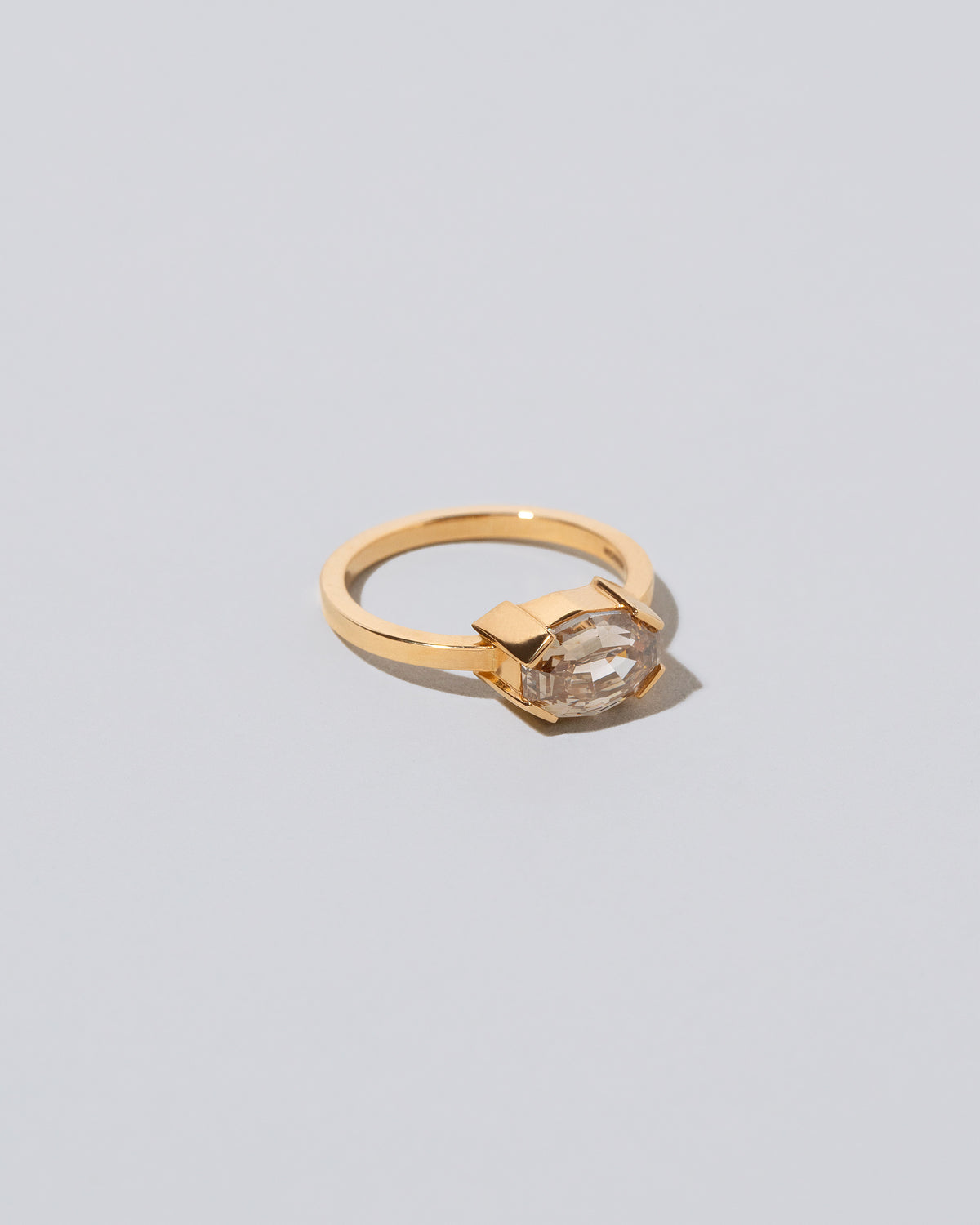 View from the side of the Metis Ring on light color background.