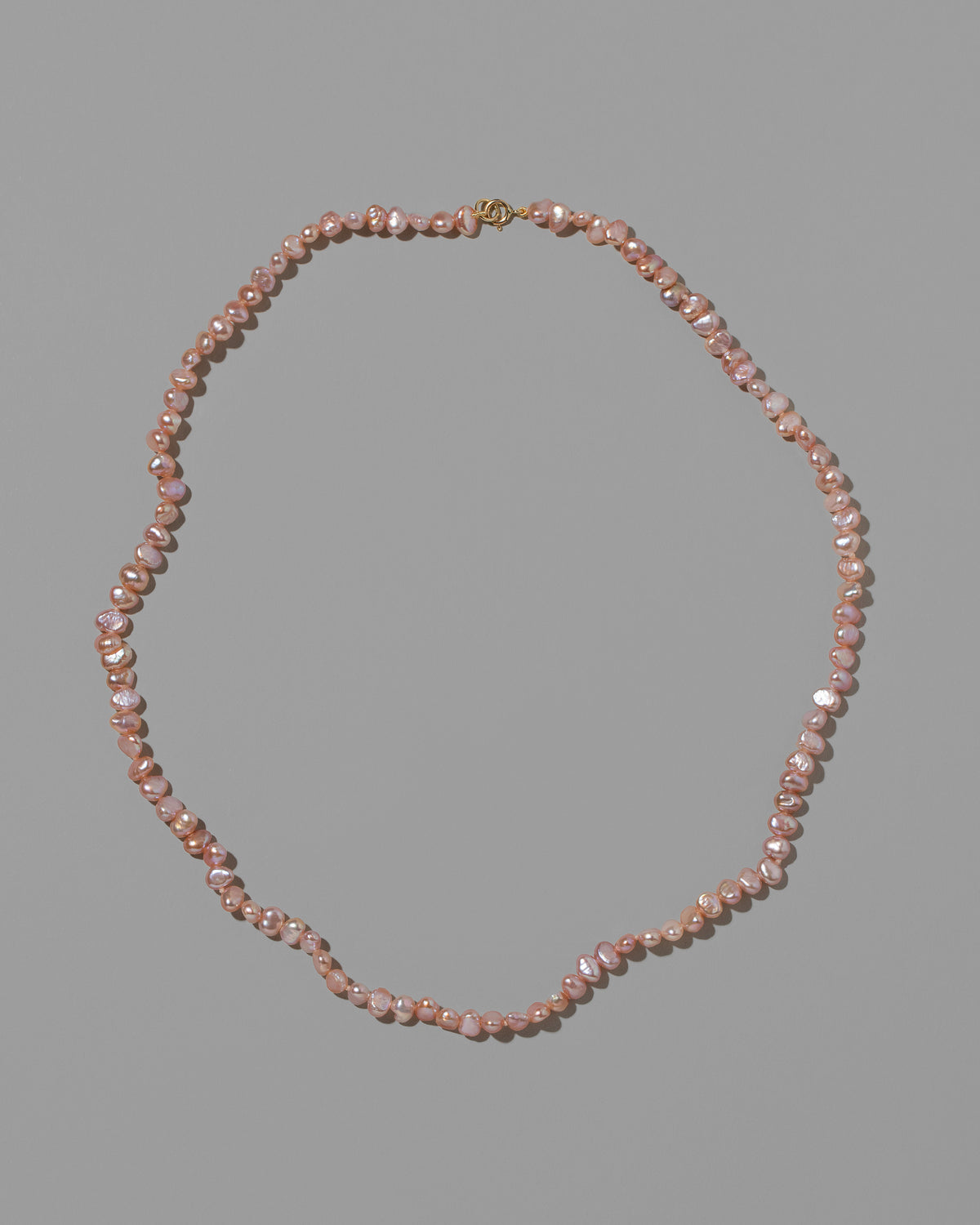 Pink Peony Baroque Pearl Necklace on light color background.