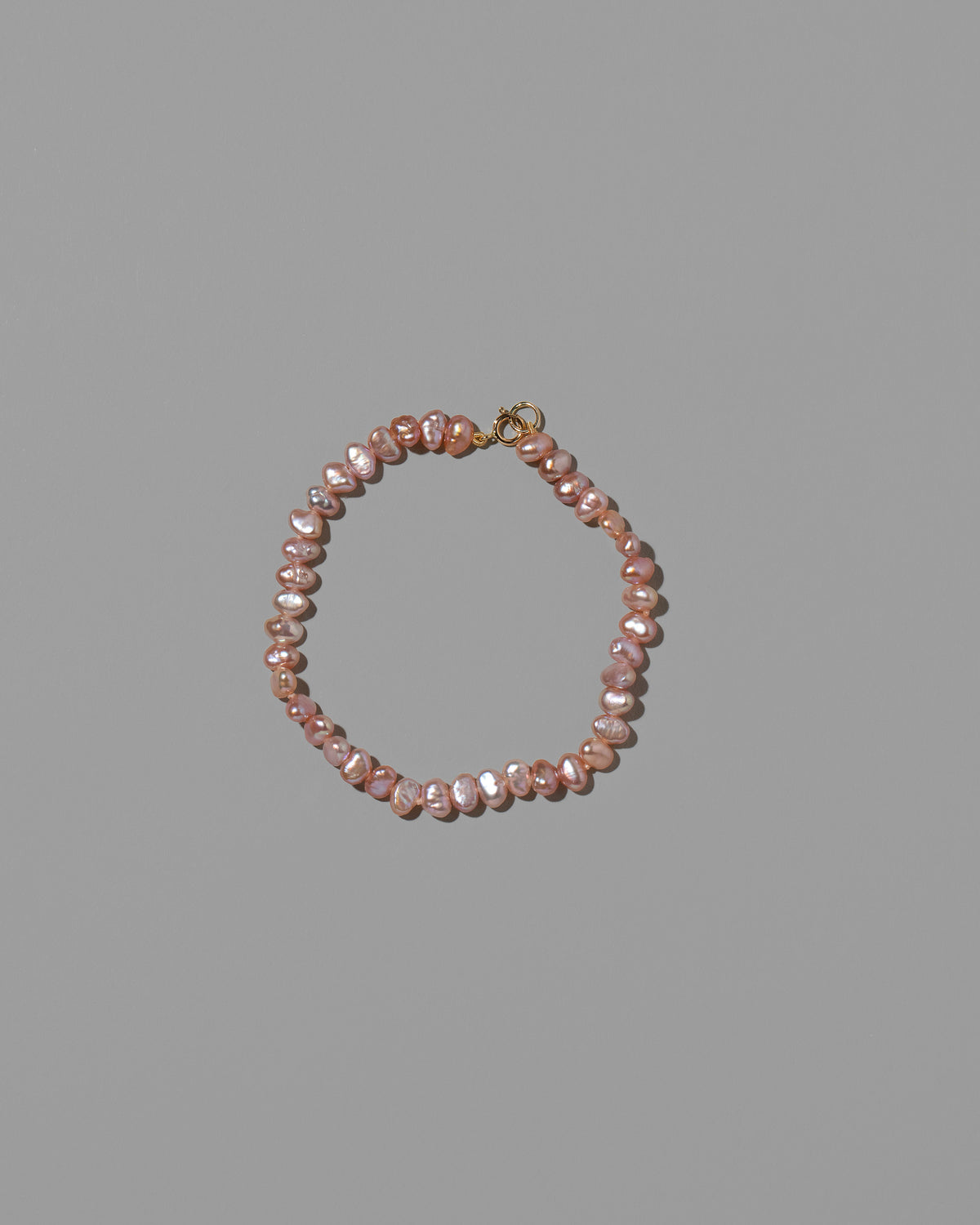 Pink Peony Baroque Pearl Bracelet on light color background.