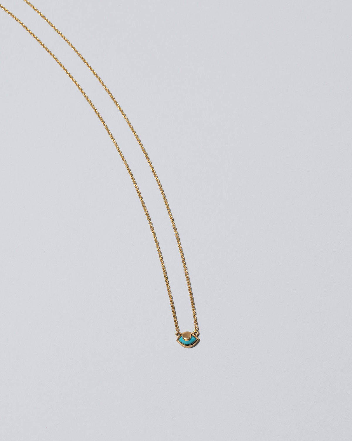 Eye See You Necklace on light color background.