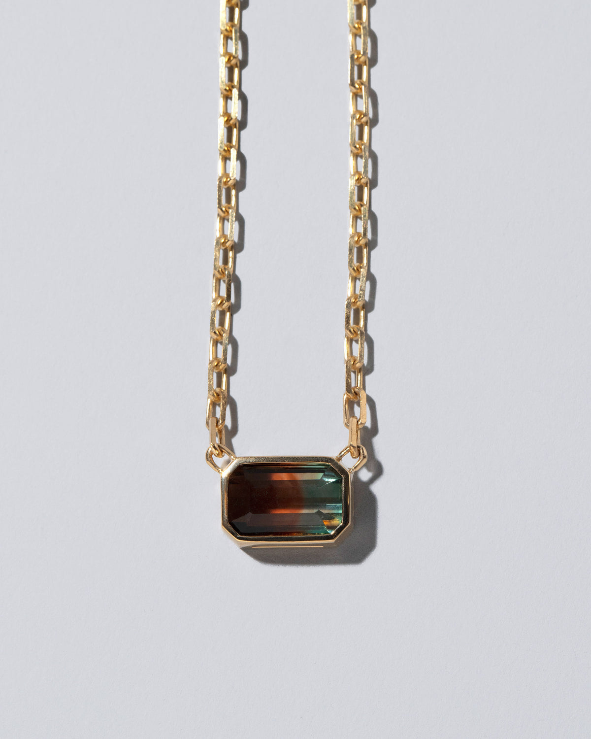 Closeup details of the Field of Love Necklace on light color background.