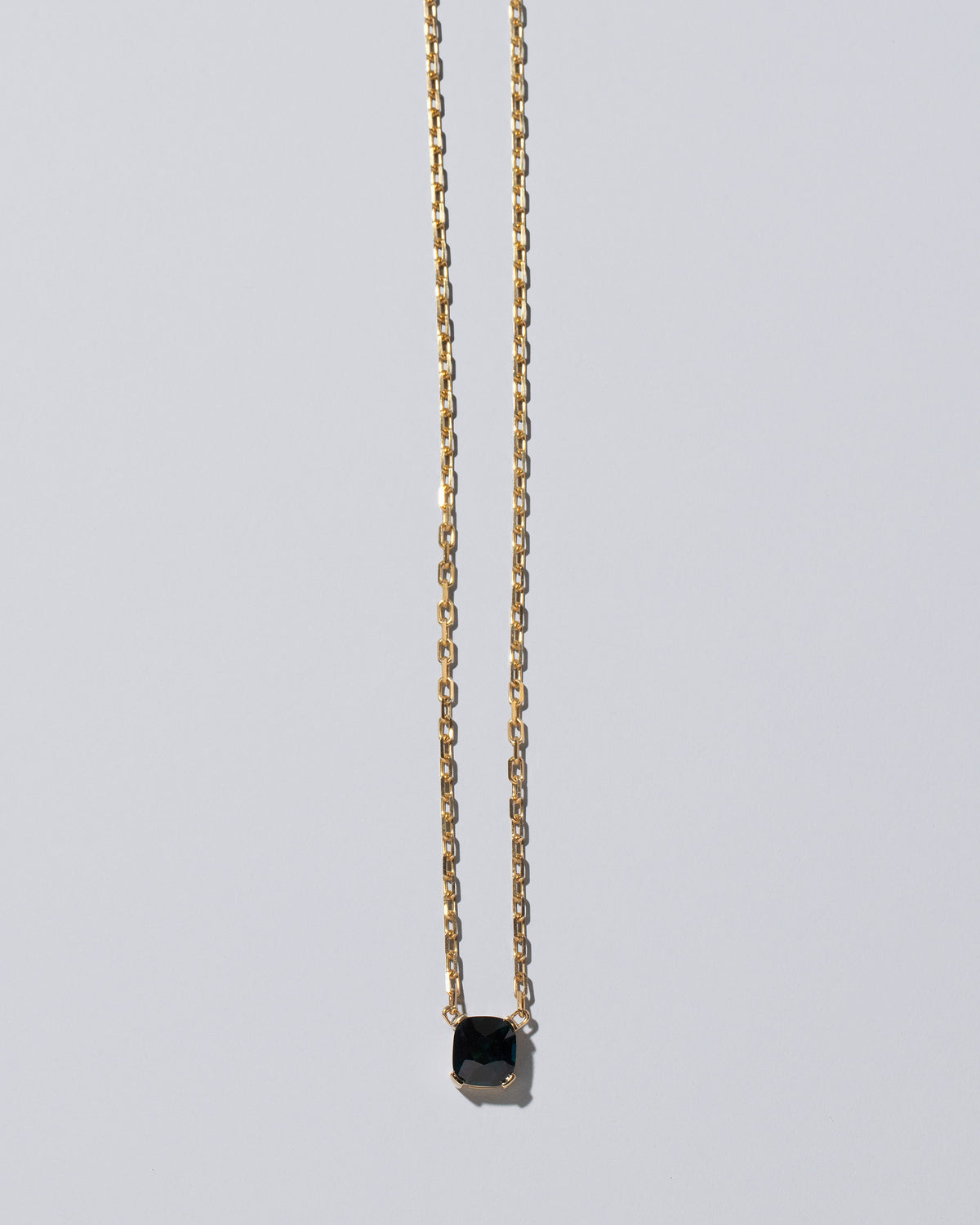 Awareness Necklace on light color background.