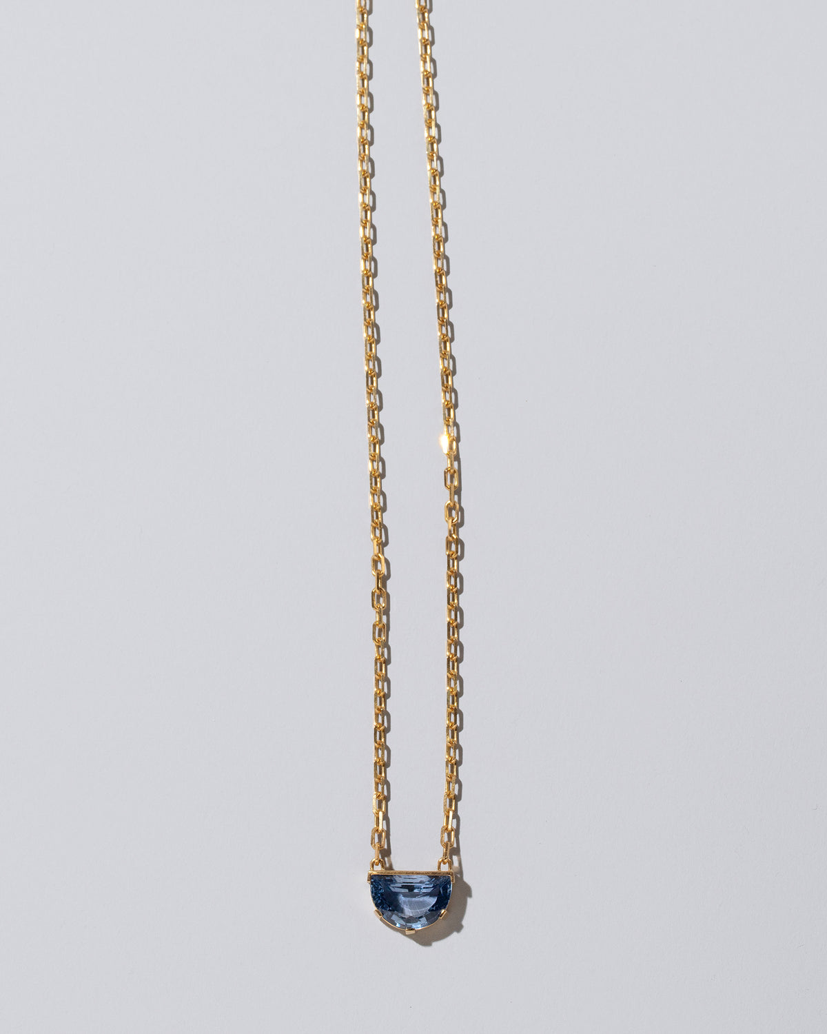 Reverence Necklace on light color background.