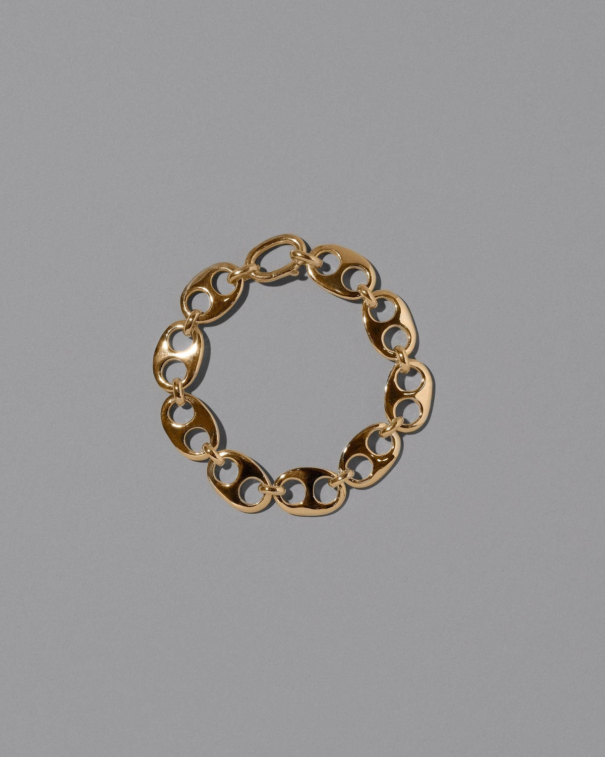 CRZM Gold Yuba Bracelet Medium on light color background.
