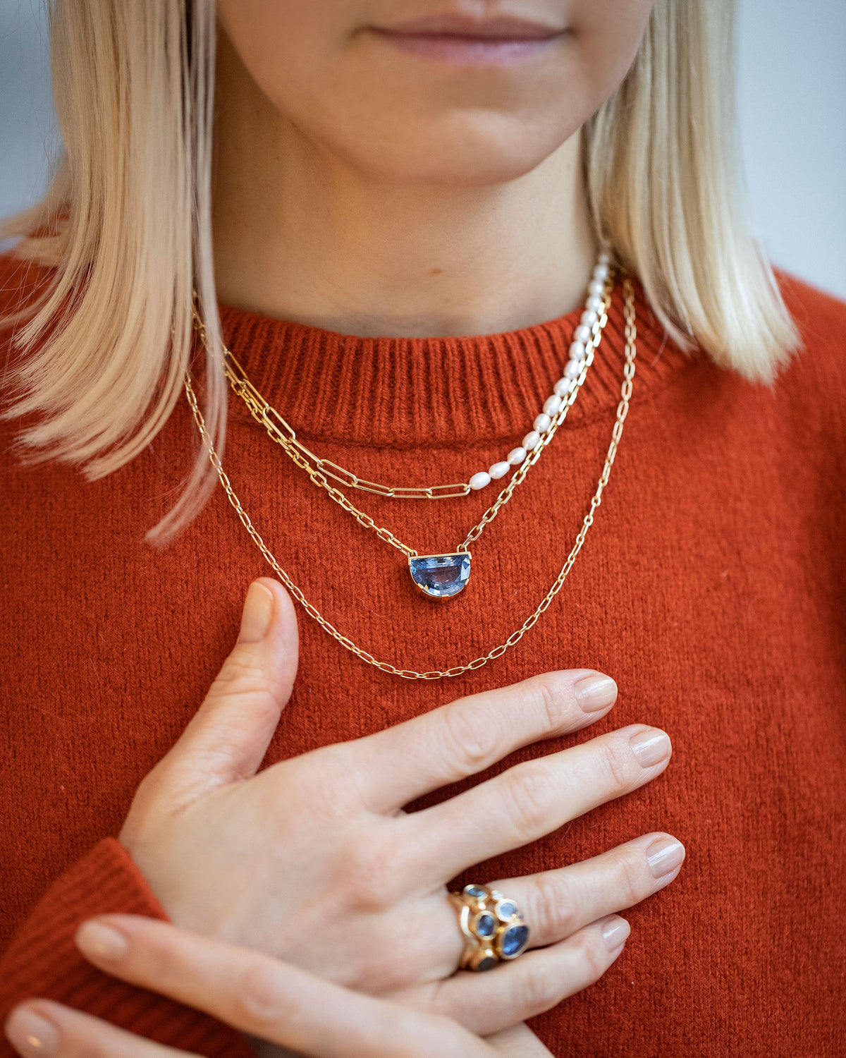 Rice Pearl Long Oval Necklace, Reverence Necklace and Hotdog Chain Necklace on model.