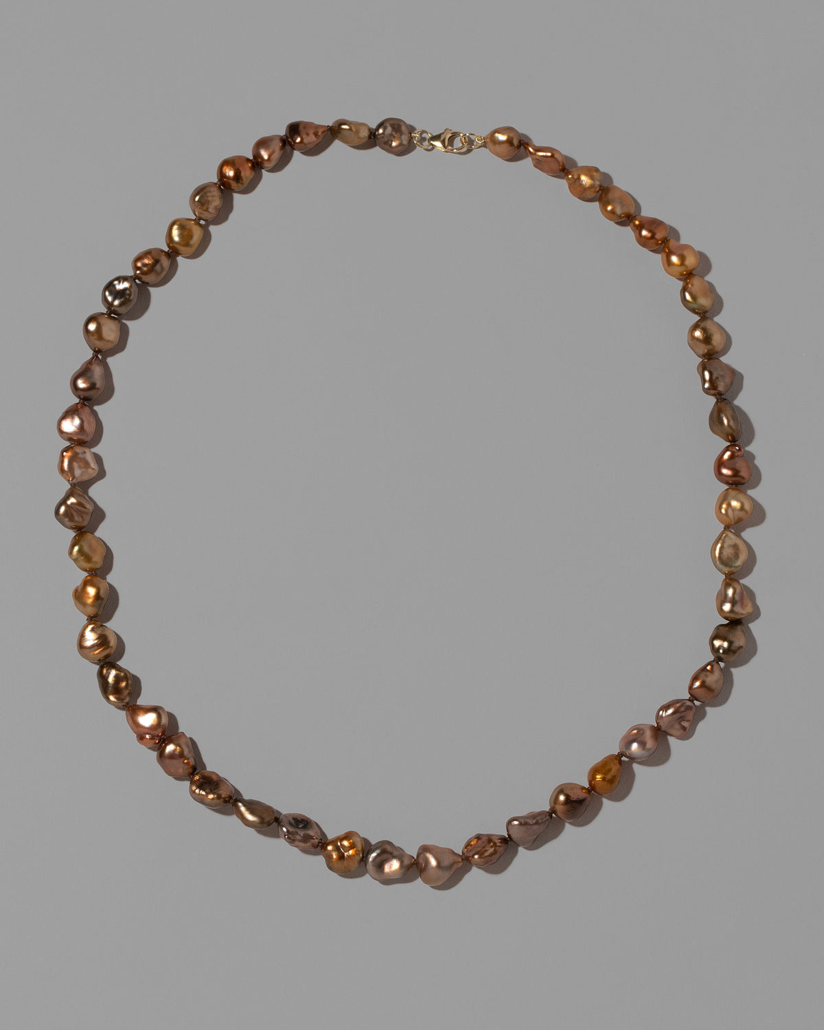 Anuket Necklace on light color background.
