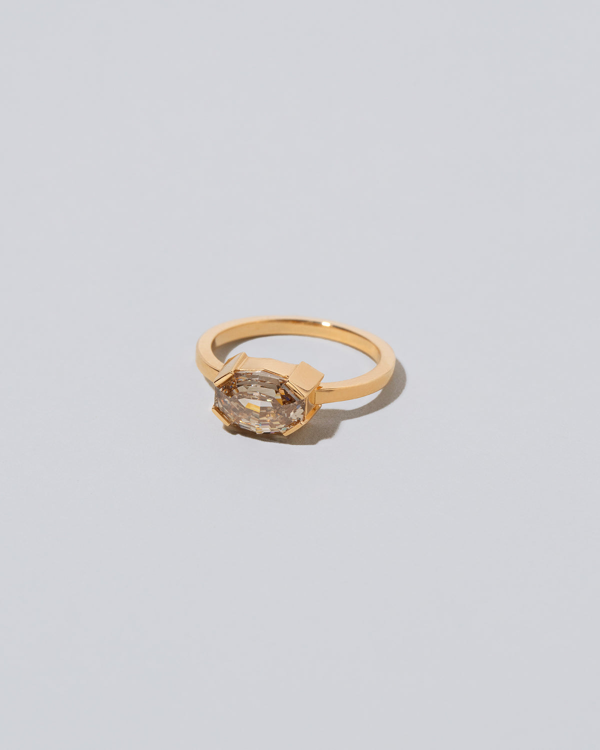 View from the side of the Metis Ring on light color background.