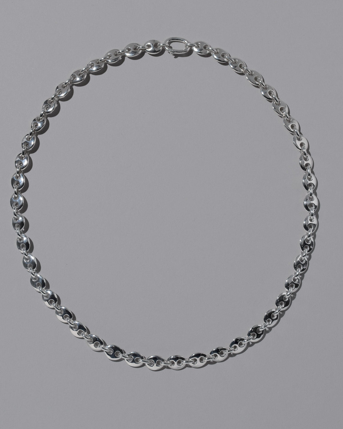 CRZM Sterling Silver Mini Bedrock Necklace on light color background.