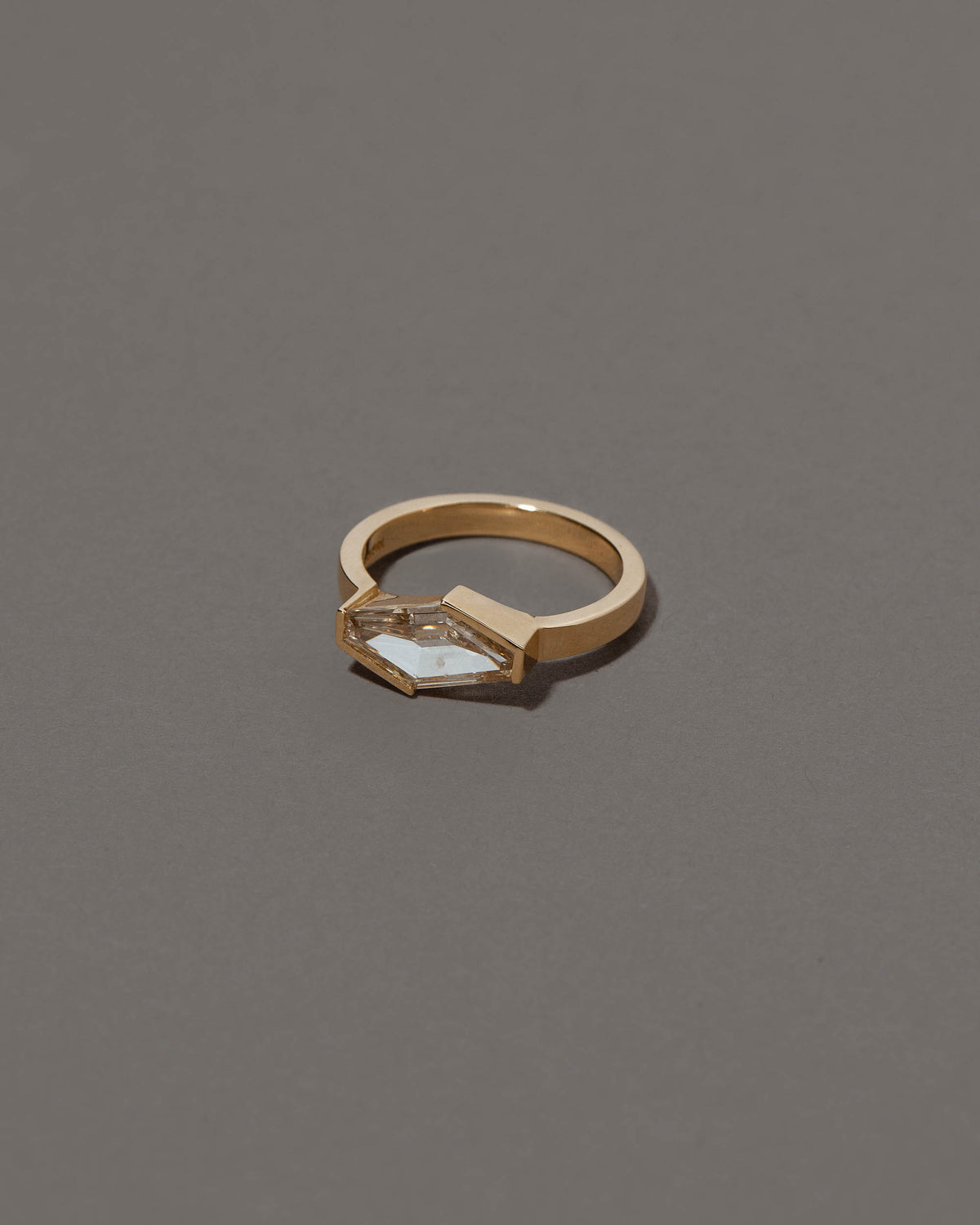 View from the side of the Mirth Ring on grey color background.