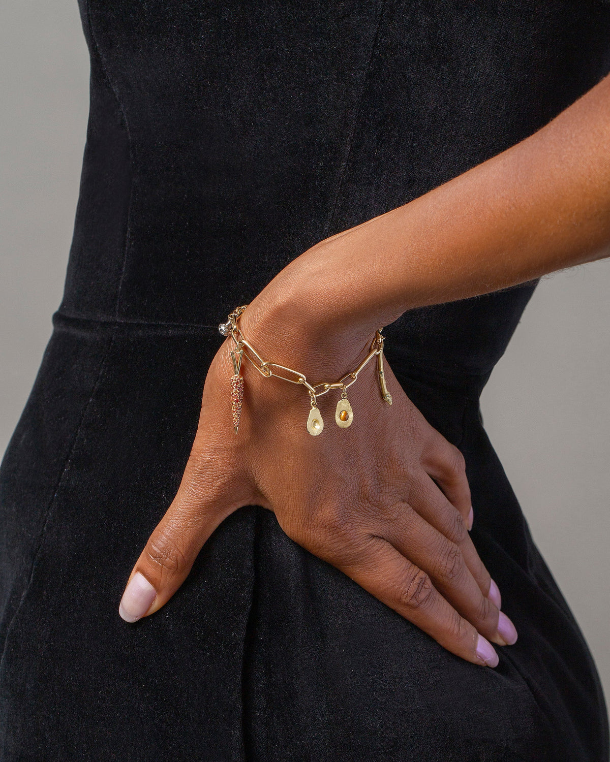 Avocado Charm, Asparagus Charm, Carrot Charm and Long Loop Chain Bracelet on model.
